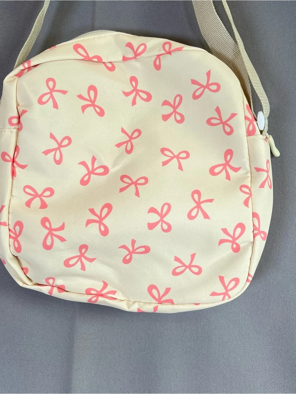 Cream Crossbody Bag w/ Pink Bow Print AdjustableStrap Top Zip & Front Zip Pocket